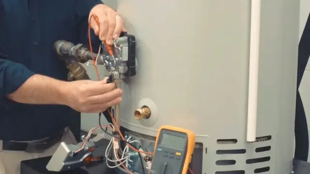 Technician testing a gas water heater with a multimeter